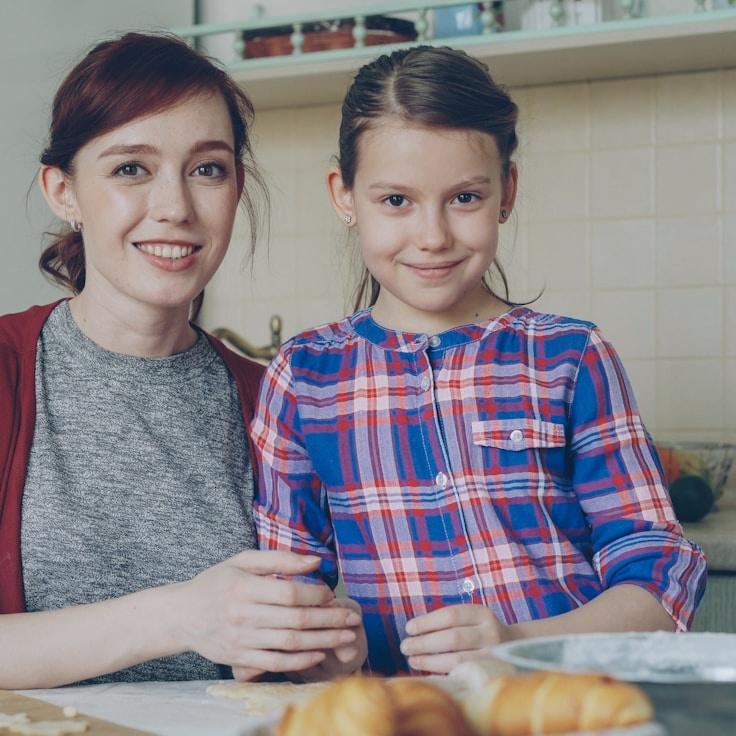 Avery Chen, Lead Design Curator at Lumi Vertalis, reviewing corporate floral arrangements